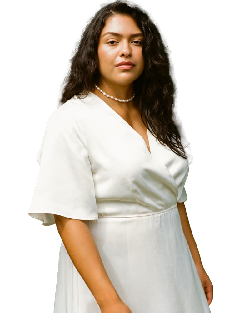 Front of a model wearing a size 2X Lola Wrap Dress in Cream by Whimsy and Row. | dia_product_style_image_id:282540